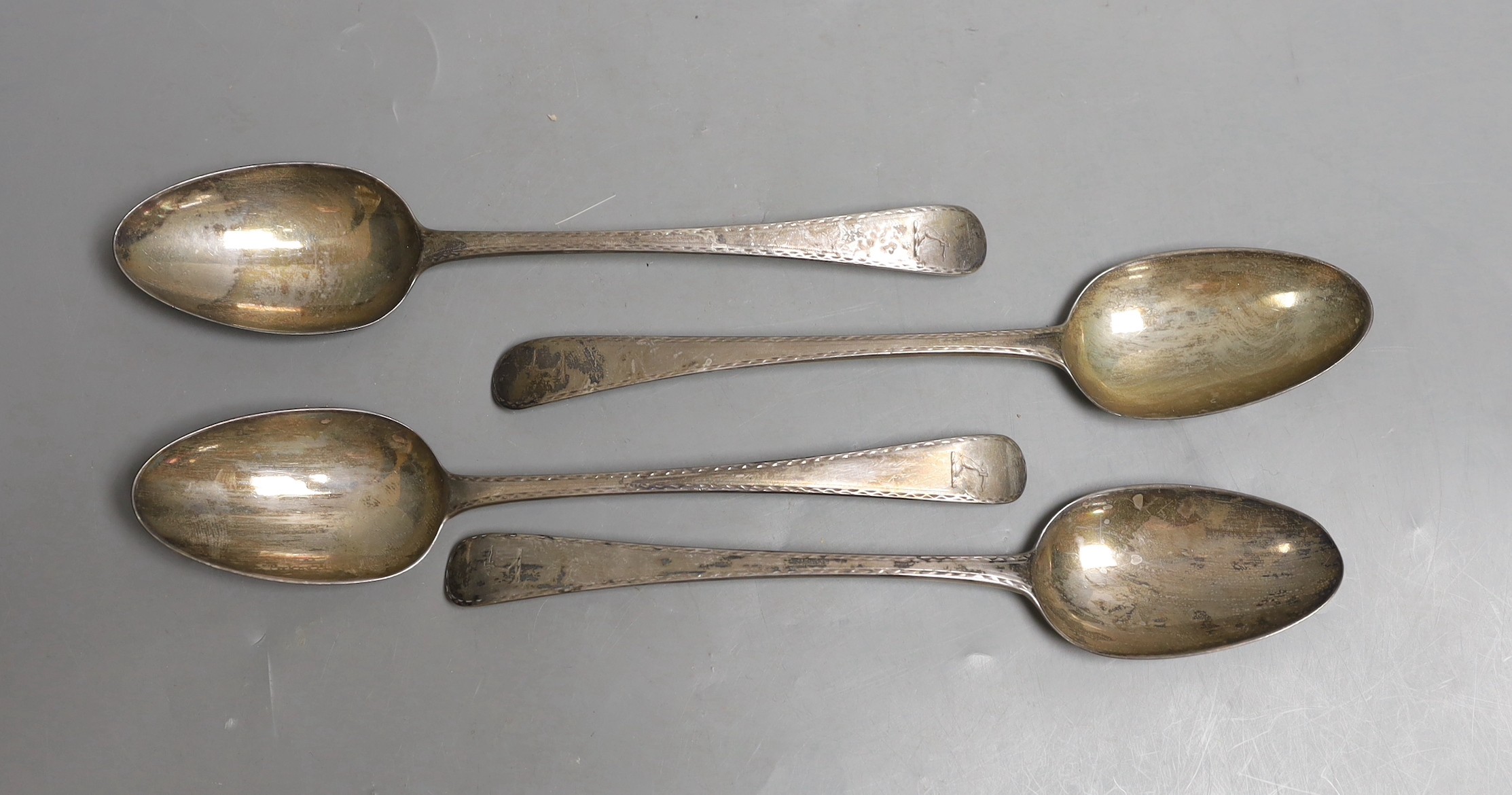 A set of four George III silver feather edge engraved Old English pattern table spoons, by George Smith, London, 1780, 21.8cm, 8.4oz.